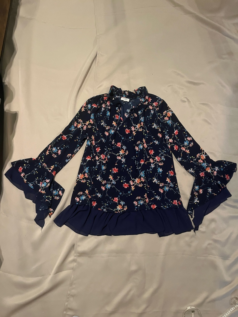 Umgee Navy Floral Ruffle-Hem Blouse with bell Sleeves